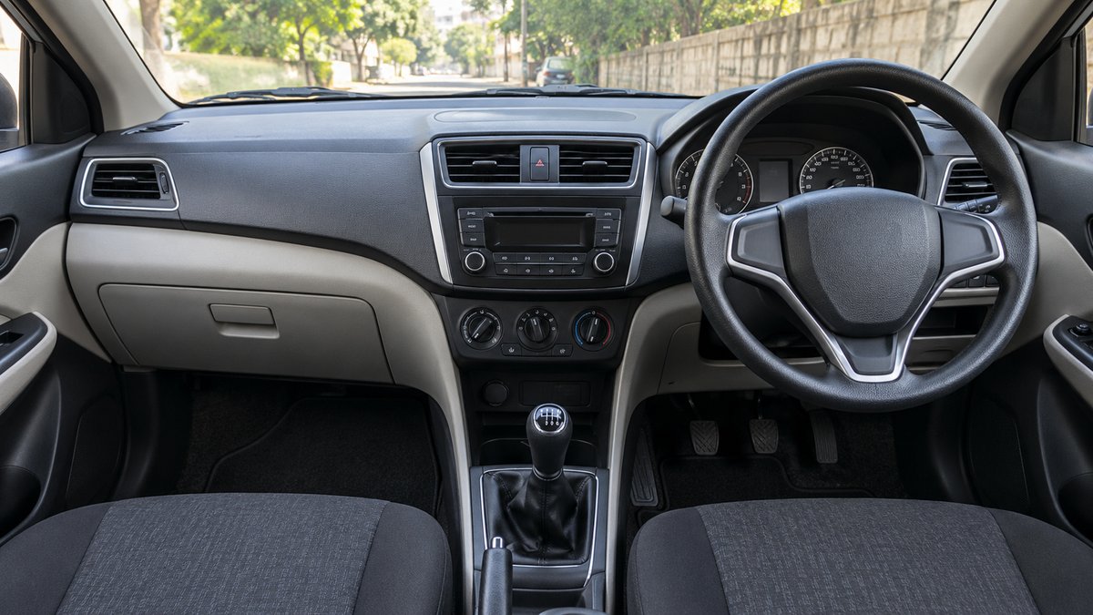 Uncluttered car dashboard and clear driver footwell